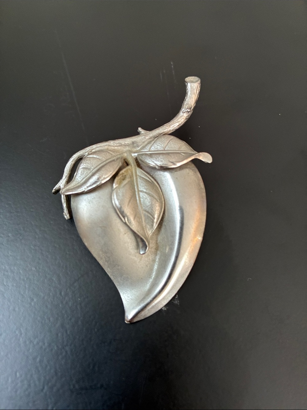 Brushed silver tone strawberry leaf brooch